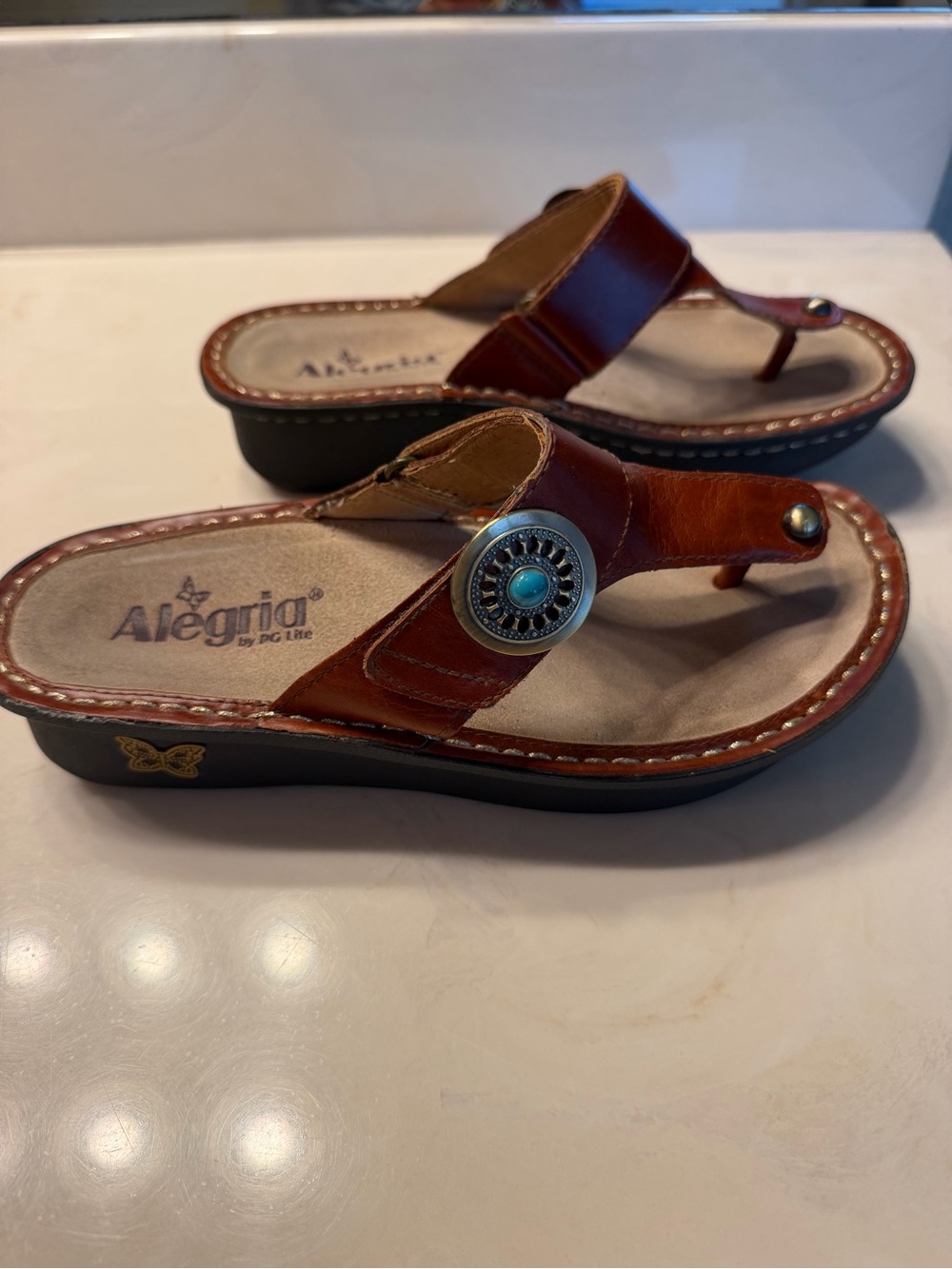 Alegria Brown Leather Thong Sandals with Turquoise Concho